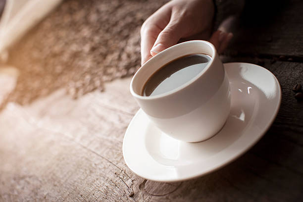 istock Hand holding cup of coffee 624654410