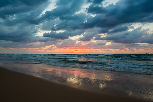 istock sea waves on the sunset background 624654694