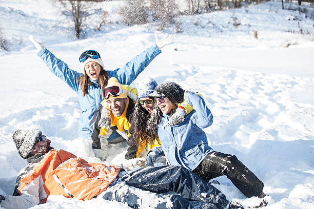 istock Group of young people having fun in the snow 624655644