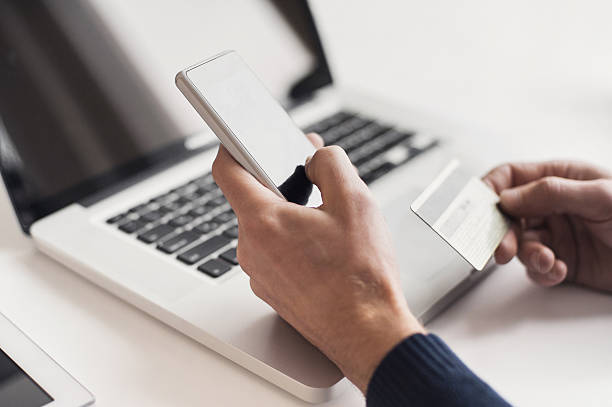 Man is shopping online with smartphone