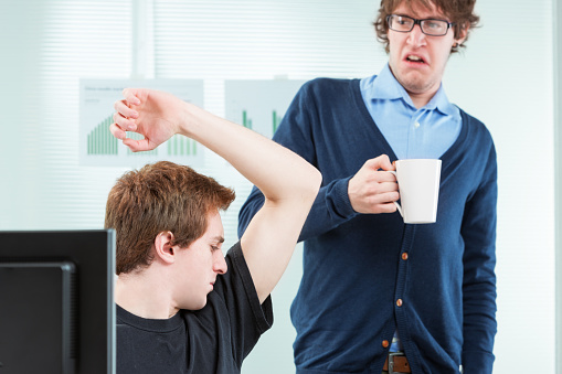 office colleague disgusted by body odour in the workplace