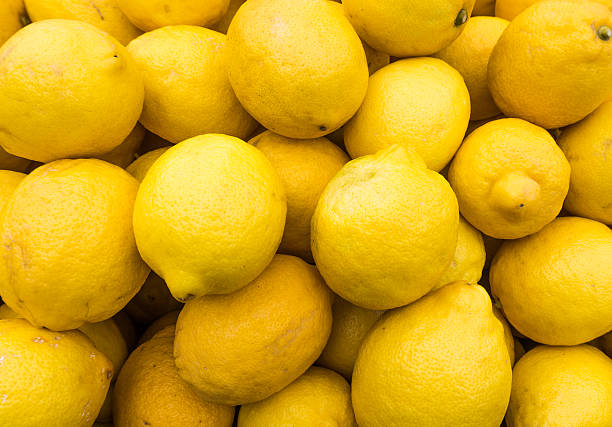 istock yellow lemons textures backgrounds.  Group of fresh lemons. 624674250