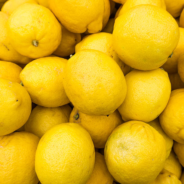 istock yellow lemons textures backgrounds.  Group of fresh lemons. 624674308