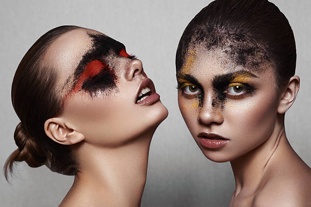 Beauty Models with art Makeup on shiny Skin