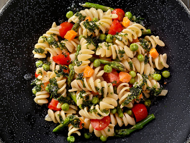 Rotini Primavera in a Browned Butter and Garlic Sauce Rotini Primavera in a Browned Butter and Garlic Sauce - Photographed on Hasselblad H3D2-39mb Camera fusilli stock pictures, royalty-free photos & images