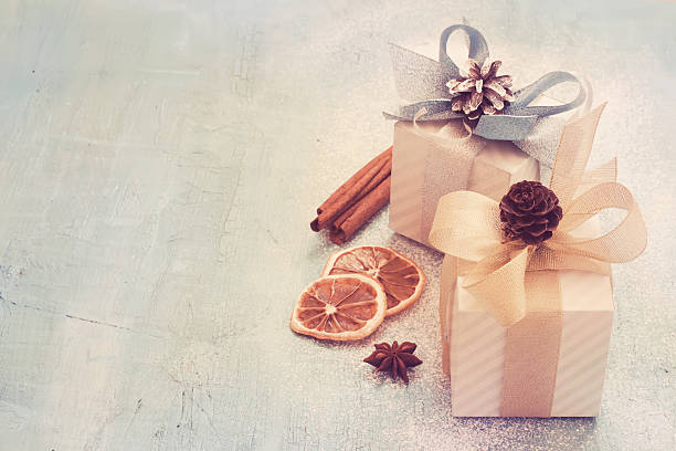 istock Christmas presents and spices on an old background, tinted. Top 624675898