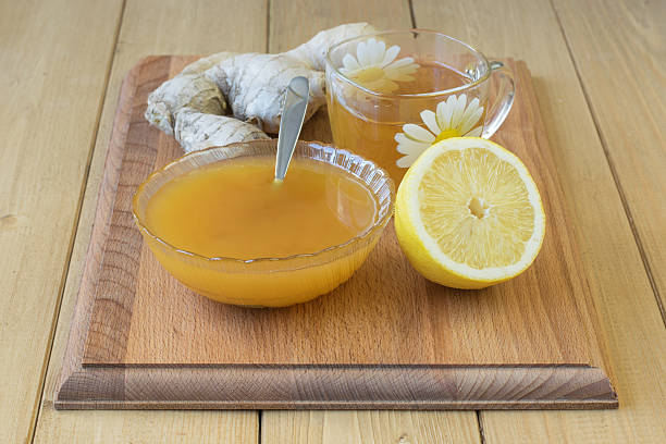 istock The root of ginger and honey on wooden table. 624677270