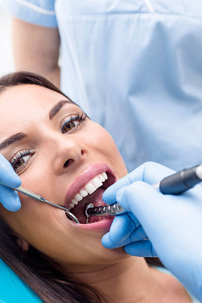 istock Young Woman At The Dentist 624677416