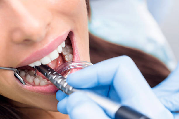 istock Young Woman At The Dentist 624678322