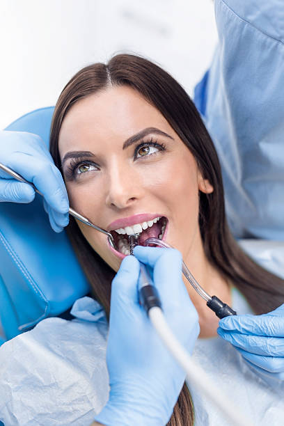 istock Young Woman At The Dentist 624679284