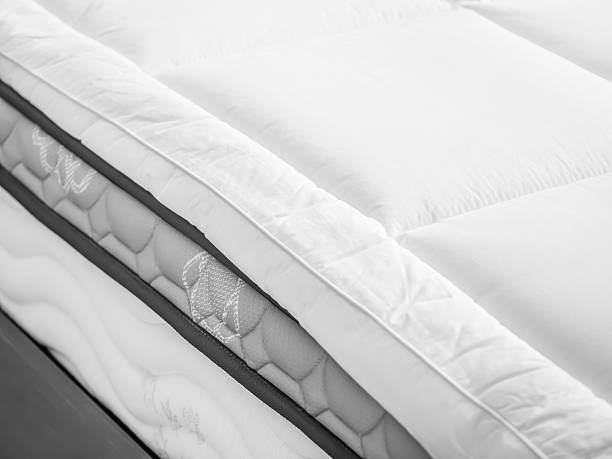 istock Bed topper on bed in bedroom 624679382
