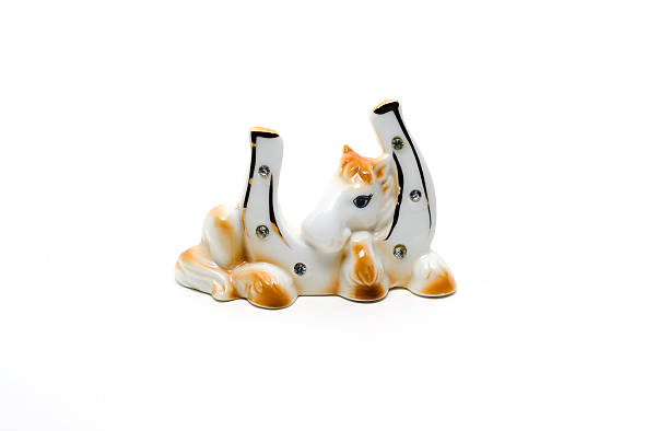 istock Ceramic toy a horseshoe isolated on white. 624680548