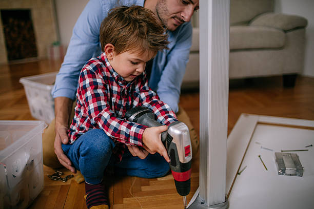 istock Little handyman and his father 624680608
