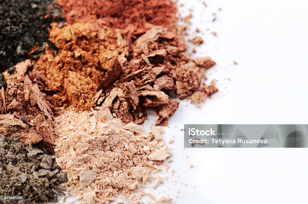 crumbled eyeshadows of different colors on a white background crumbled eyeshadows of different colors on a white background horizontal, space for text Face Powder Stock Photo