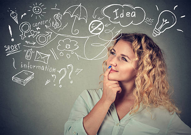 istock woman thinking dreaming has many ideas looking up 624681574