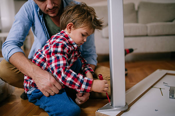 istock Little handyman and his father 624681716
