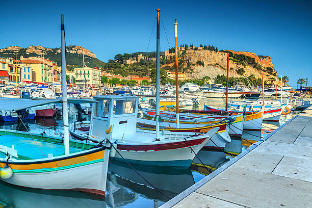 Spectacular harbor with Cap Canaille cliffs,France,Europe Stunning fishing harbor with colorful boats in Cassis,Marseille,France,Europe casis stock pictures, royalty-free photos & images