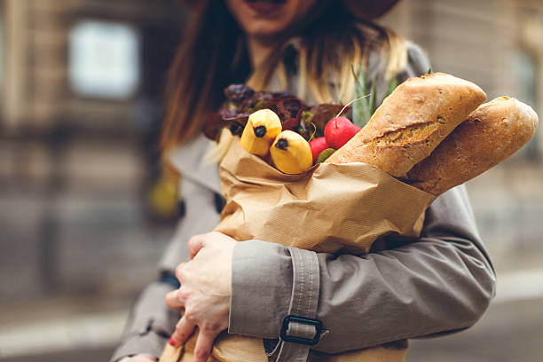 Young woman carrying groceries