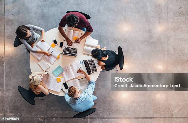 University Students Doing Group Study Stock Photo - Download Image Now - Group Of People, Teamwork, Learning
