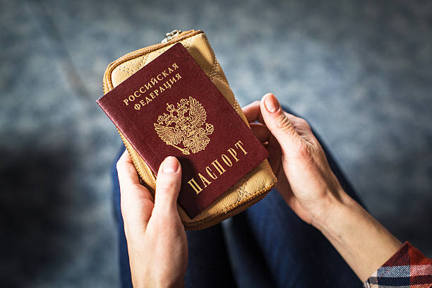 istock girl holding a Russian passport 624696116