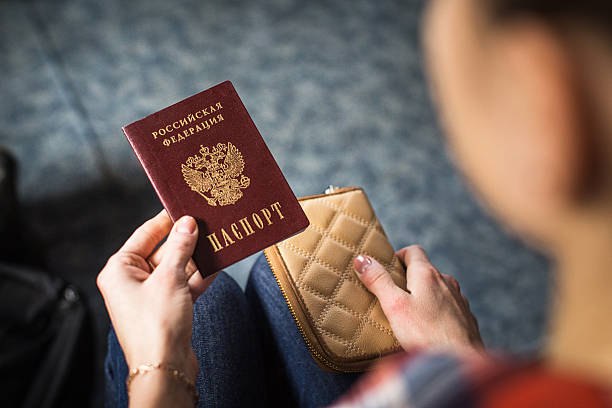 istock girl holding a Russian passport 624696198