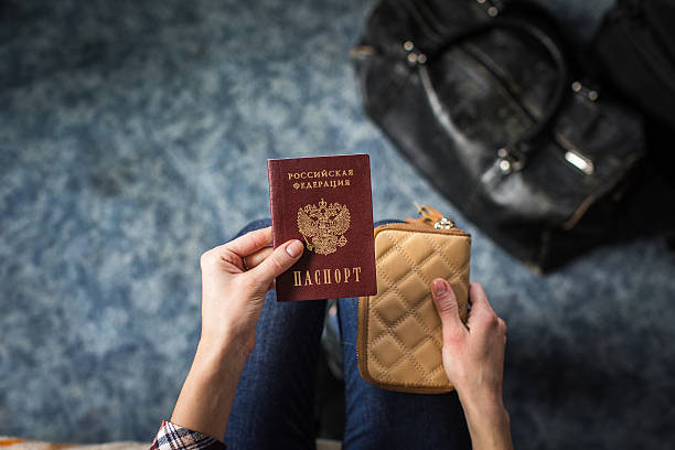 istock girl holding a Russian passport 624696522