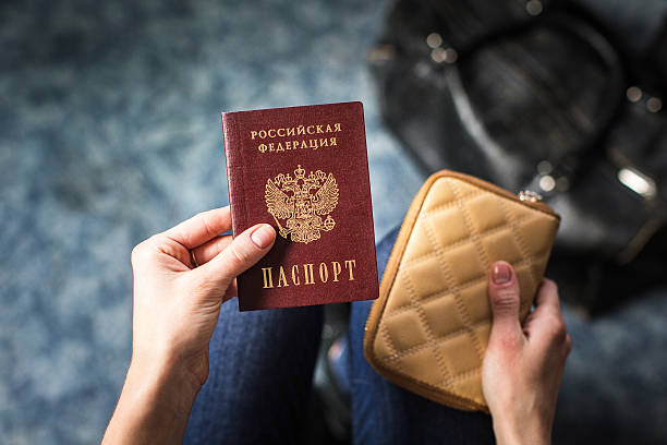 istock girl holding a Russian passport 624696632