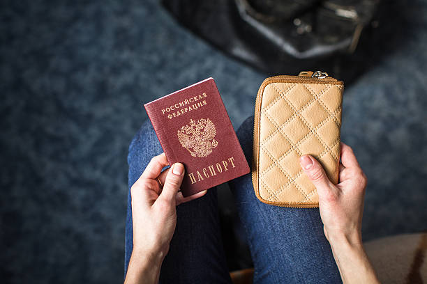 istock girl holding a Russian passport 624696730