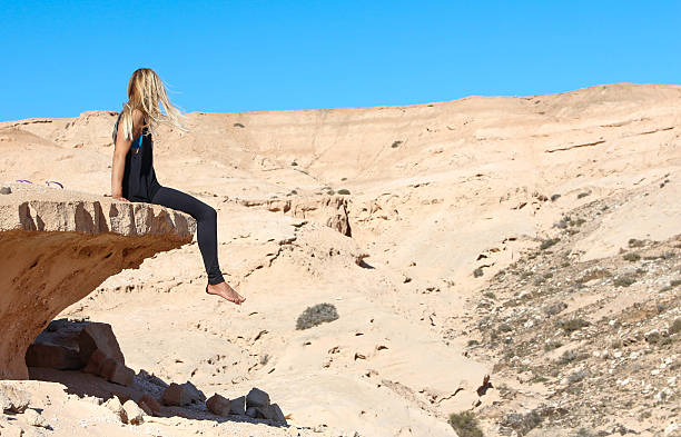 istock Free young woman sitting on a sand 624696858