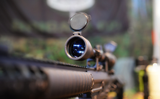 Closeup of a rifle scope in army shop