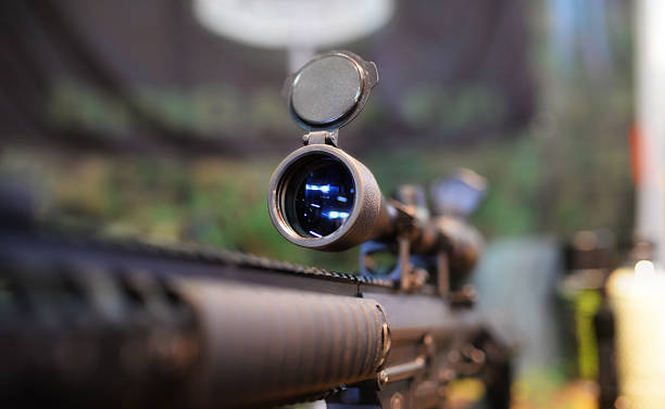 Scoped rifle in army shop Closeup of a rifle scope in army shop carbine stock pictures, royalty-free photos & images