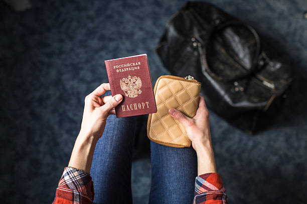 istock girl holding a Russian passport 624696894