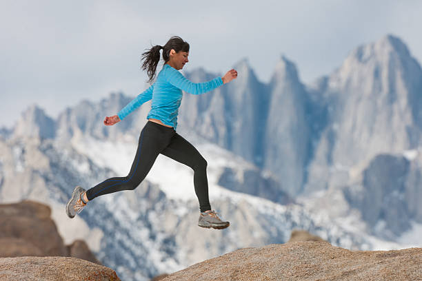 istock Women Trail Runner Stretching In The Mountains 624698442