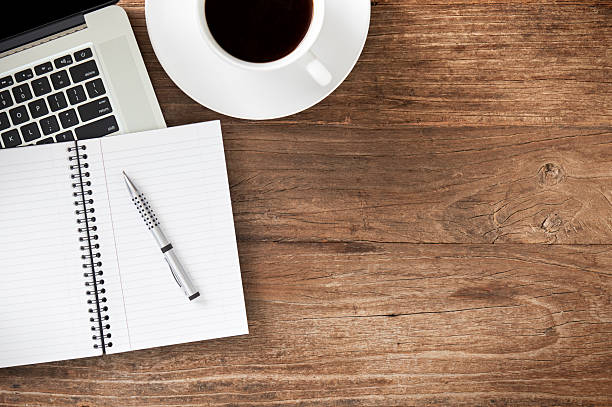 istock Workspace with laptop on distressed wooden desk 624698820