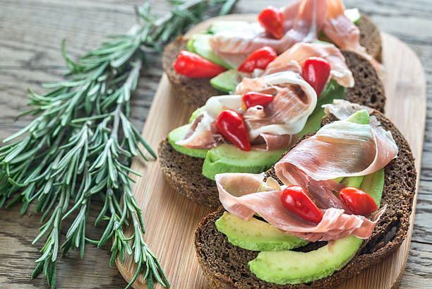 istock Sandwiches with avocado and prosciutto 624699092