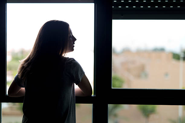 istock Teenager near a window. 624699106
