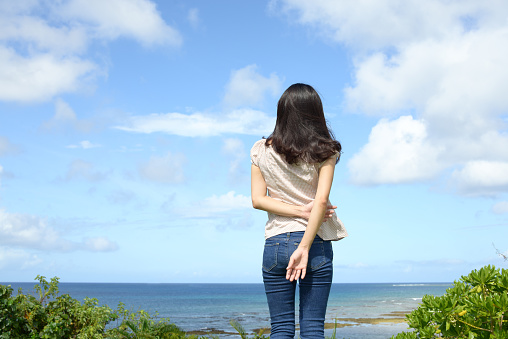 Young woman by the sea