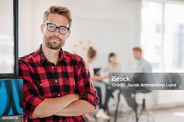 Portrait Of Positive Businessman In Office Stock Photo - Download Image Now - Men, Office, Relaxation