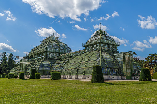 The Palmenhaus Schonbrunn is a large greenhouse in Vienna, Austria, featuring plants from around the world. It was opened in 1882.