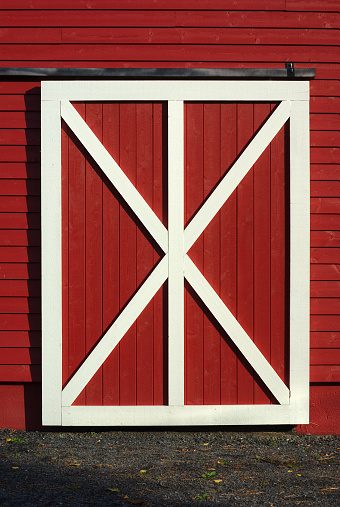 door of cowshed, red barn white plank closeup wood shed