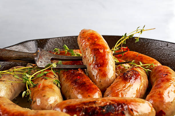 istock Home-made Pork Sausages in rustic pan with thyme 624702102