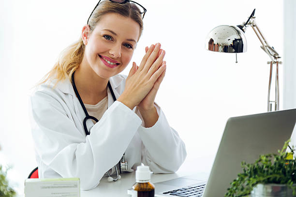 istock Confident female doctor in the office looking at camera. 624702292