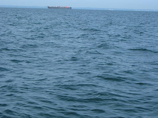 istock Wave with Freighter in far the Distance 624702810