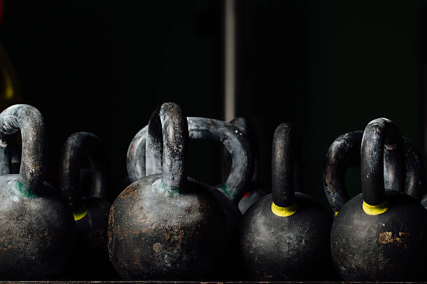 istock Dumbbell for weight training in gym. Black kettlebells. 624709892