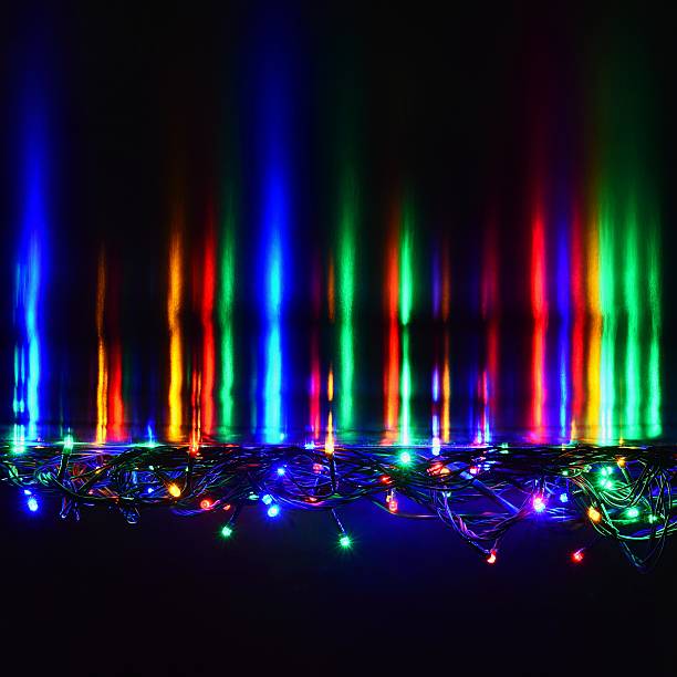 istock Christmas lights on black background with copy space. Colored. 624710136