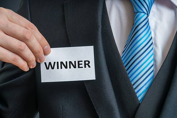 istock Man is showing label that He is a winner. 624711910