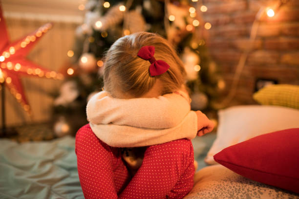 Sad little girl for Christmas stock photo