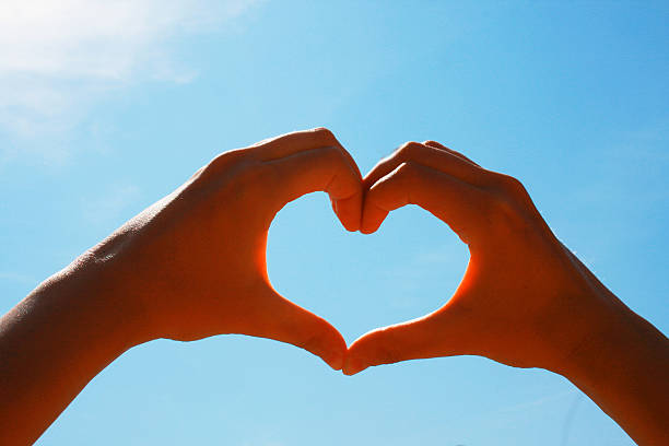 istock Heart of two hands 624715250