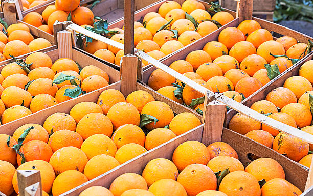istock Closeup oranges on a market 624717480