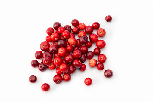 Fruit: Close up of Fresh and ripe cranberry fruits on white